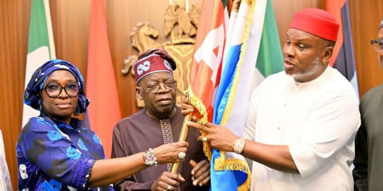 President Tinubu hands over APC flag