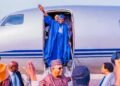 President Bola Tinubu waving on a plane